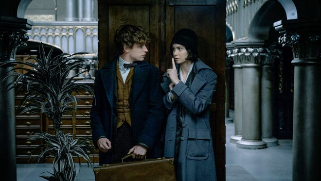 Newt (Eddie Redmayne) and Tina (Katherine Waterston) are fugitives on a mission in 'Fantastic Beasts and Where to Find Them.'