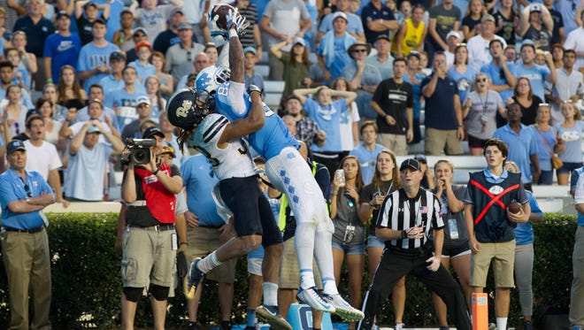North Carolina Tar Heels wide receiver Bug Howard (84) catches the game tying touchdown during the fourth quarter against the Pittsburgh Panthers at Kenan Memorial Stadium. Carolina defeated Pitt 37-36.