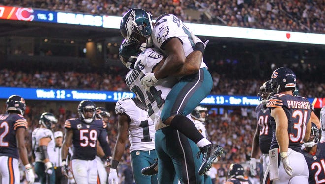 Eagles running back Ryan Mathews (24) celebrates his touchdown run with Darren Sproles (43) during the second half against the Bears.
