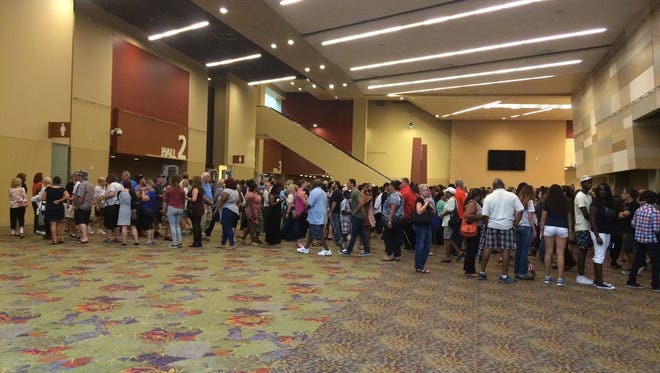 People line up to go through security at the Phoenix Convention Center to hear Michelle Obama on Oct. 20, 2016.