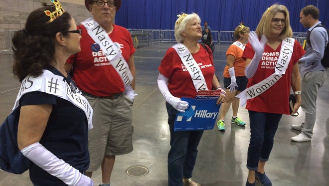 Hillary Clinton supporters were spotted dressed as Mr. and Mrs.  "Nasty Woman" at the Phoenix Convention Center after Michelle Obama gave her speech on Oct. 20, 2016.