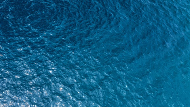 Aerial shot of clear sea water.
