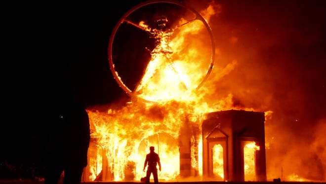 The Burning Man event hit its high point Saturday night with the burning of the proverbial Man, which stood about 80 feet above the desert floor and was destroyed by fireworks and explosions.