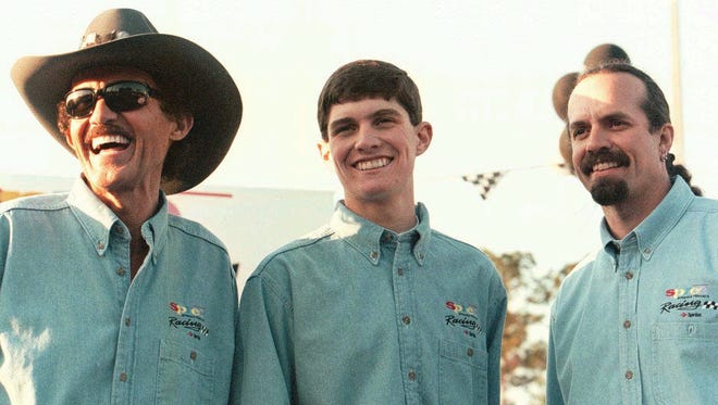 RIchard Petty, left, and grandson Adam, center, and son, Kyle, are all smiles after announcing that Adam will be taking his first major step in professional racing by driving the (45) Spree Prepaid Foncard car in the American Speed Association series in 1998.