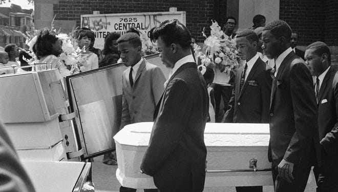 Pallbearers carry the tiny casket of Tanya Blanding, 4, a victim of riots in Detroit, Tuesday, August 1, 1967. The girl was killed as a hail of police and National Guard bullets swept an apartment building where she huddled on the floor. Officials said the flare of a match used to light a cigarette was mistaken for the flash of a sniper's gun.