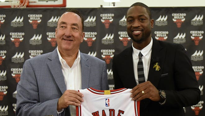 Dwayne Wade and Bulls general manager Gar Forman pose for a photo after addressing the media after a press conference at Advocate Center.