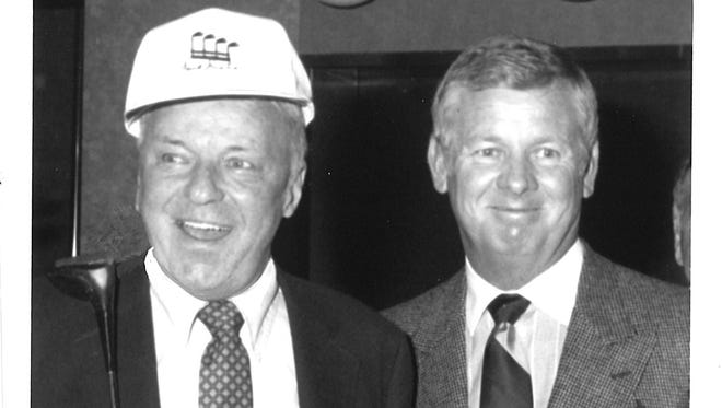 Frank Sinatra discusses the progress of his Celebrity Invitational golf tournament, scheduled for Feb. 3 and 4, 1989, at Canyon Country Club. He's pictured with Ralph Hitchcock, director of tournament volunteers. Dec. 29, 1988.