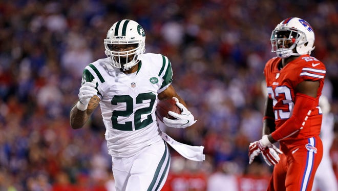 New York Jets running back Matt Forte (22) runs for a touchdown as Buffalo Bills strong safety Aaron Williams (23) pursues during the second half at New Era Field.