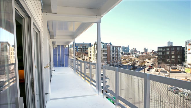 Sliding glass doors on the west side of the fourth-floor terrace studio apartments open up views of N. Water St.