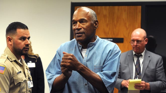 O.J. Simpson reacts after learning he was granted parole at Lovelock Correctional Center.