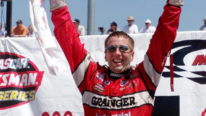 Greg Biffle celebrates winning the goracing.com 200 at Michigan Speedway in 1999. Biffle got his start in the Camping World Truck Series, where he won 16 career races.