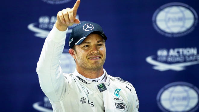Rosberg of Mercedes AMG Petronas celebrates after taking the pole position.