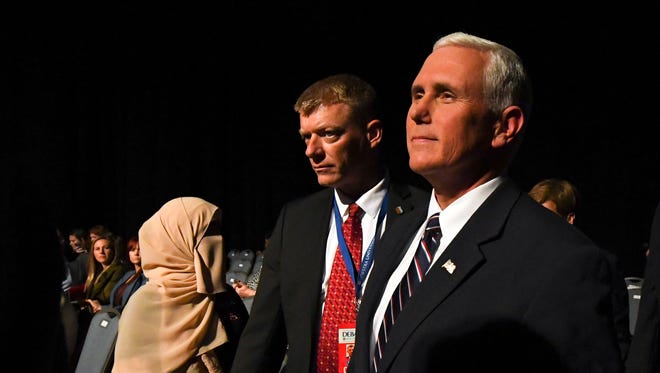 Republican vice presidential candidate Mike Pence enters the hall before the first presidential debate at Hofstra University between Democratic presidential candidate Hillary Clinton and Republican presidential candidate Donald Trump.