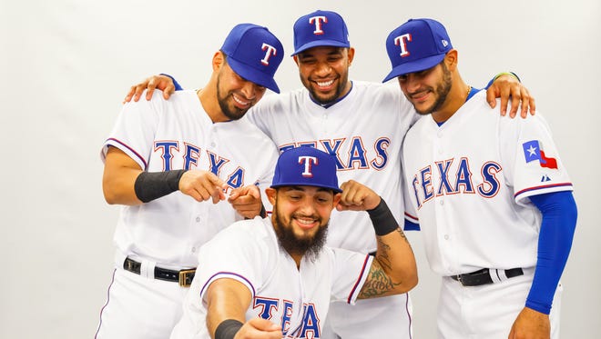 Rangers second baseman Rougned Odor (front) takes a selfie with catcher Robinson Chirinos , shortstop Elvis Andrus and pitcher Martin Perez