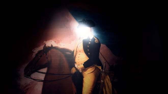 An exhibit light washes out the face of British General Burgoyne inside the Museum of The American Revolution Thursday, Feb. 23  in Philadelphia. The museum opens April 19, 2017.