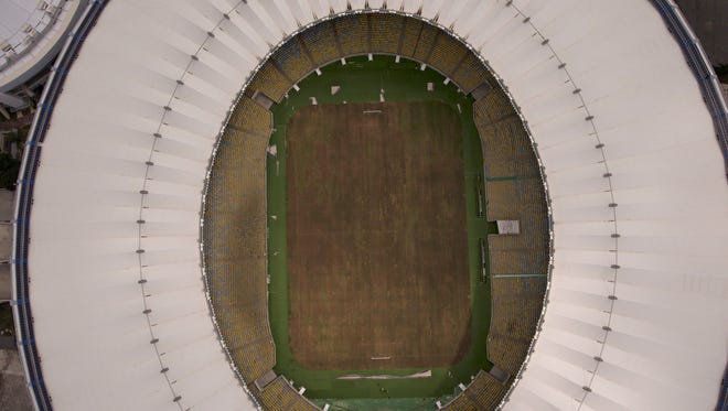 This Feb. 2, 2017 photo shows Maracana stadium ' s dry playing field in Rio de Janeiro. The stadium was renovated for the 2014 World Cup at a cost of about $500 million, and largely abandoned after the Olympics and Paralympics, then hit by vandals who ripped out thousands of seats and stole televisions.