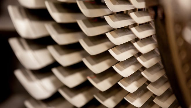 Like rows of teeth, dozens of tiny fan blades cover the exposed inner core of an engine at Delta's TechOps facility in Atlanta on April 29, 2016.