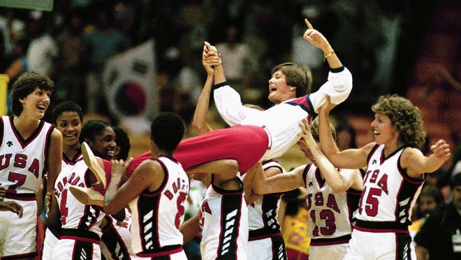 Summitt, coach of the 1984 U.S. women's basketball team is carried off by players following their 85-55 Olympic gold medal win over South Korea in Los Angeles.