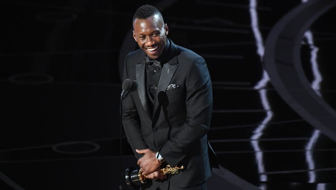 Mahershala Ali accepts the the Oscar for Best Supporting Actor for his role in 'Moonlight' during the 89th Academy Awards.