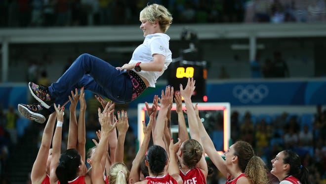 Serbia coach Marina Maljkovic celebrates with her team after beating France in the women's basketball bronze medal match during the Rio 2016 Summer Olympic Games at Carioca Arena 1.