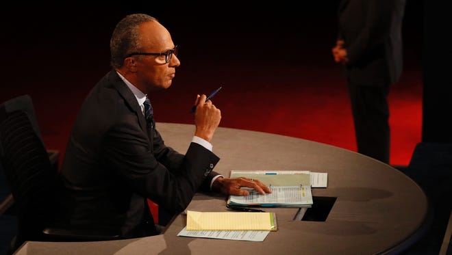 Debate moderator Lester Holt is seen during the first presidential debate at Hofstra University.