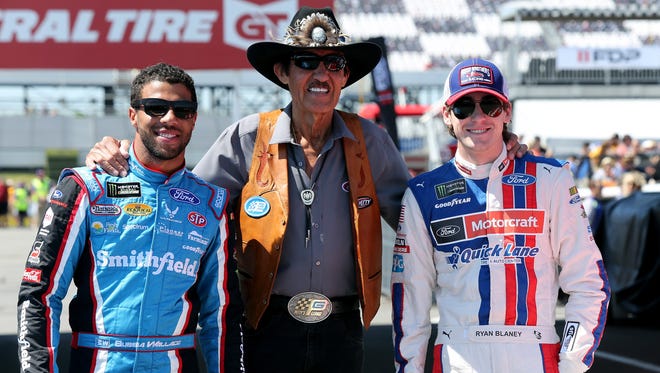 Richard Petty, center, poses with drivers Darrell Wallace Jr., left, and Ryan Blaney, right, at Pocono Raceway on June 11, 2017. Wallace was making his Cup Series debut with Richard Petty Motorsports.