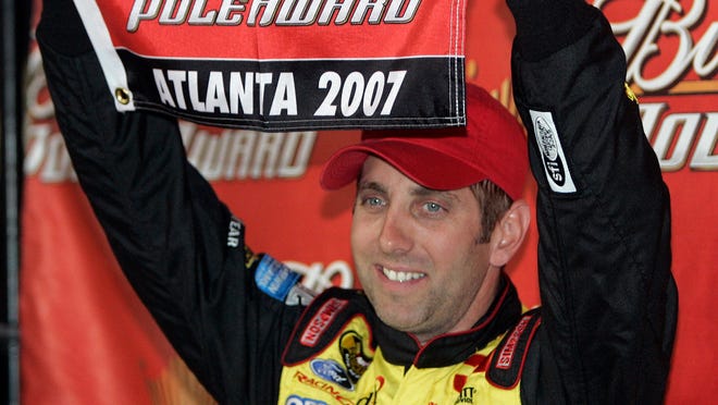 Greg Biffle celebrates after winning the pole for the Pep Boys 500 at Atlanta Motor Speedway in 2007.