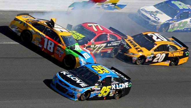 Kyle Busch (18),  Erik Jones (77) and Matt Kenseth (20) wreck with a few laps remaining at the end of the second segment. All three Toyota drivers were knocked out of the race with damage.