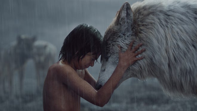 Mowgli (Neel Sethi) shares a moment with his wolf mom Raksha (voiced by Lupita Nyong'o) in 'The Jungle Book.' The film won the Oscar for Best Visual Effects during the 89th Academy Awards.