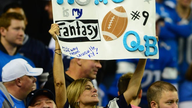 Fans holds a sign showing support for Romo.
