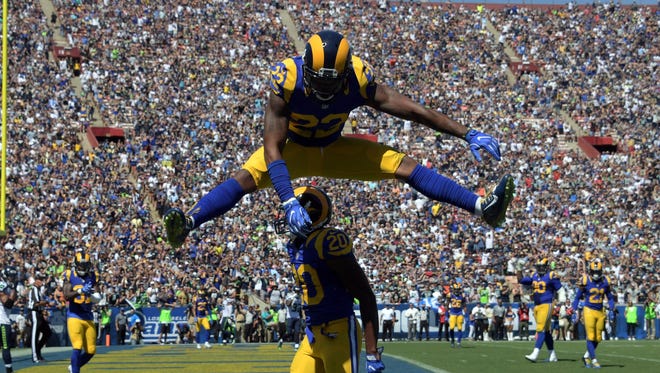 Rams defender Lamarcus Joyner (20) celebrates a defensive stop with Trumaine Johnson (22) during the first half against the Seahawks.