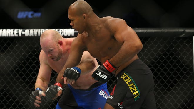 Jacare Souza (red gloves) fights Tim Boetsch (blue gloves) during UFC 208 at Barclays Center.