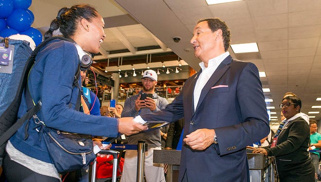 United Airlines CEO Oscar Munoz (right) greats an Olympian at a send-off for members of the U.S. Olympic team at Houston Bush Intercontinental on Aug. 3, 2016.