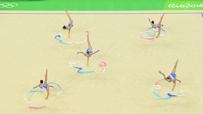 The United States competes during the women's rhythmic gymnastics group all-around qualification during the Rio 2016 Summer Olympic Games at Rio Olympic Arena.