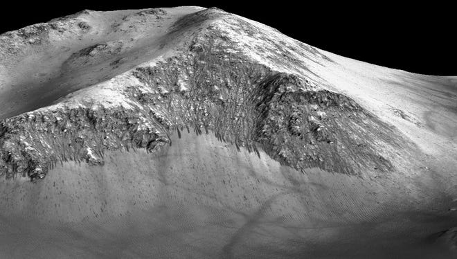 These dark, narrow, 100 meter-long streaks called recurring slope lineae flowing downhill on Mars are inferred to have been formed by contemporary flowing water. Recently, planetary scientists detected hydrated salts on these slopes at Horowitz crater, corroborating their original hypothesis that the streaks are indeed formed by liquid water.