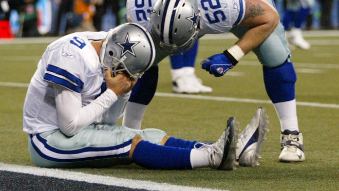 QB Tony Romo's first playoff start for the Cowboys ended in disaster at Seattle.