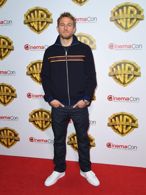 'King Arthur' himself, actor Charlie Hunnam looked regal even in just denim and a zip-up.
