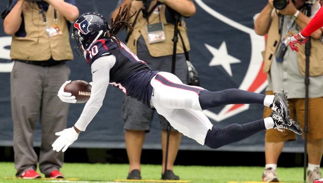 Texans receiver DeAndre Hopkins dives across the goal line for a first-half touchdown against the Chiefs.