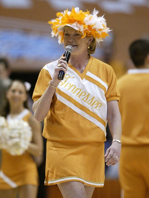 Summitt wears a cheerleading uniform while singing "Rocky Top" during a timeout of a men's basketball game between Tennessee and Florida in 2007.