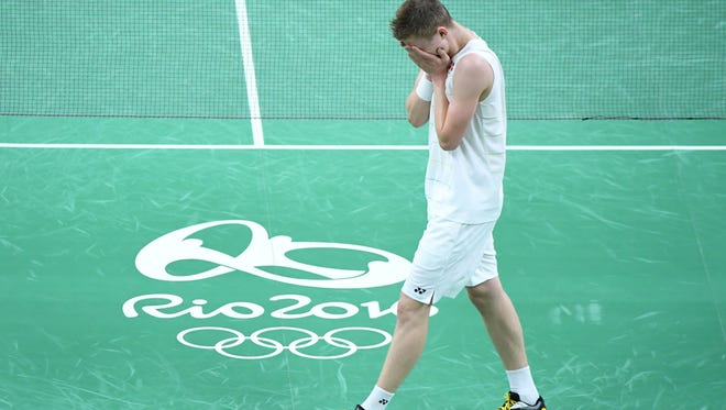 Viktor Axelsen of Denmark celebrates after his defeat of Dan Lin of China during the men's badminton singles bronze medal match during the Rio 2016 Summer Olympic Games at Riocentro - Pavilion 4.