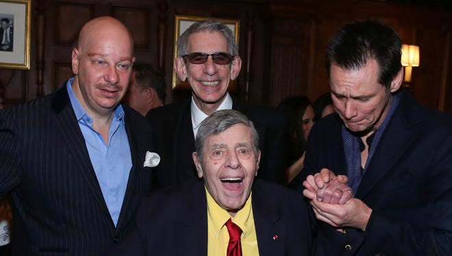 (L-R) Comedians Jeff Ross, Richard Belzer, Jerry Lewis and Jim Carrey attend the 90th Birthday Celebration of Jerry Lewis at The Friars Club on April 8, 2016, in New York.