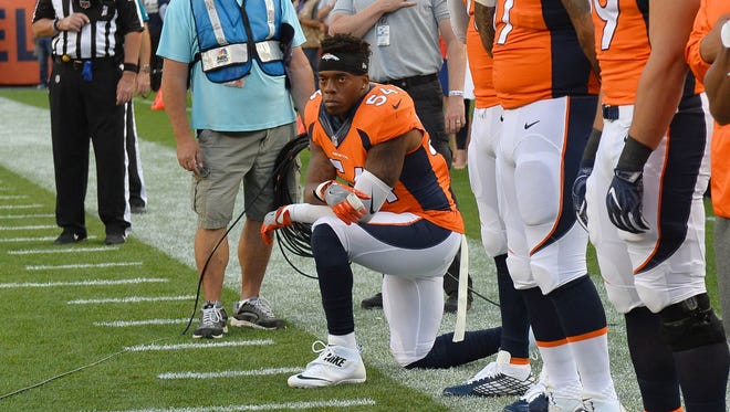 Broncos linebacker Brandon Marshall knelt during the national anthem before the NFL's season-opening Thursday night showcase against the Panthers.