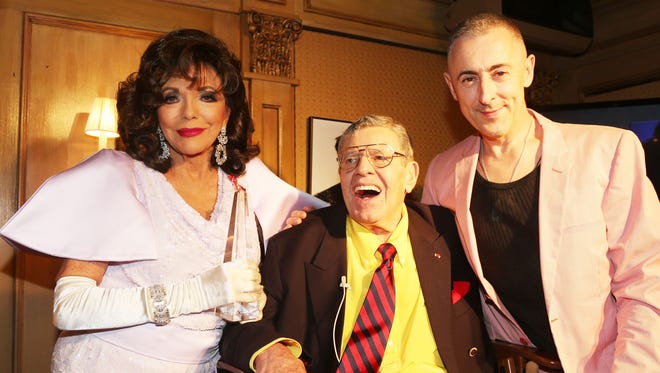(L-R) Joan Collins, Jerry Lewis and Alan Cumming at the Friars Club salute to Joan Collins pose at The Friars Club on May 4, 2015 in New York.