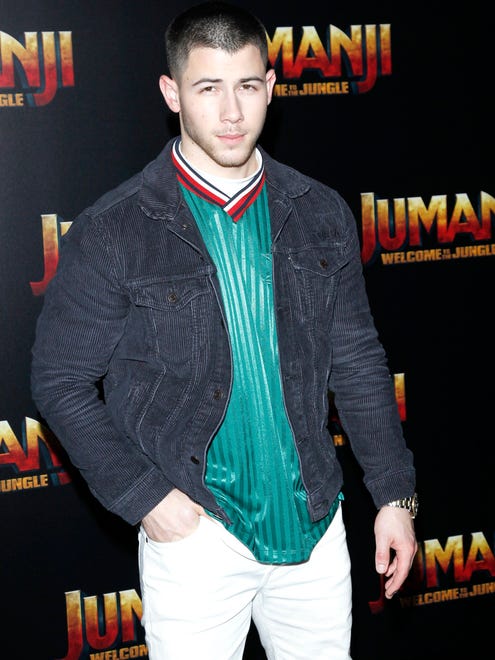 epa05874548 US actor Nick Jonas stands for photographers during a photo call for Jumanji: Welcome to the Jungle, backstage at the Sony Pictures Entertainment presentation at CinemaCon 2017 at Caesars Palace in Las Vegas, Nevada, USA, 27 March 2017.  EPA/NINA PROMMER ORG XMIT: NPX01