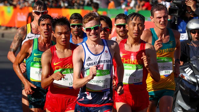 Tom Bosworth, Zelin Cai, and Zhen Wang during the men's 20-kilometer walk.
