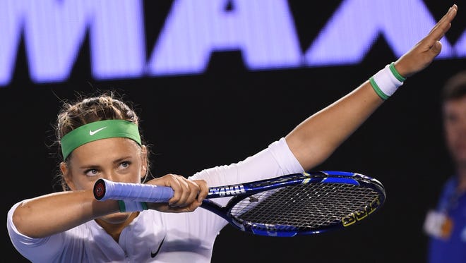 Belarus's Victoria Azarenka gestures as she celebrates after victory in her women's singles match against Belgium's Alison Van Uytvanck on day two of the 2016 Australian Open tennis tournament in Melbourne on January 19, 2016.