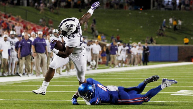TCU running back Trevorris Johnson (24) breaks a tackle for a touchdown against Southern Methodist.
