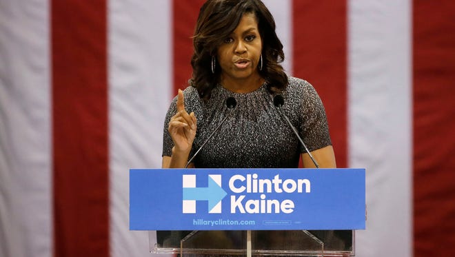 First lady Michelle Obama addresses the Arizona Democratic Party Early Vote rally at the Phoenix Convention Center on Thursday, Oct. 20, 2016, in Phoenix. Michelle Obama is campaigning for Democratic presidential nominee Hillary Clinton.