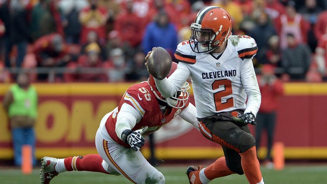 Cleveland Browns quarterback Johnny Manziel (2) looks to pass and is pressured by Kansas City Chiefs linebacker Dee Ford (55) during the second half at Arrowhead Stadium.