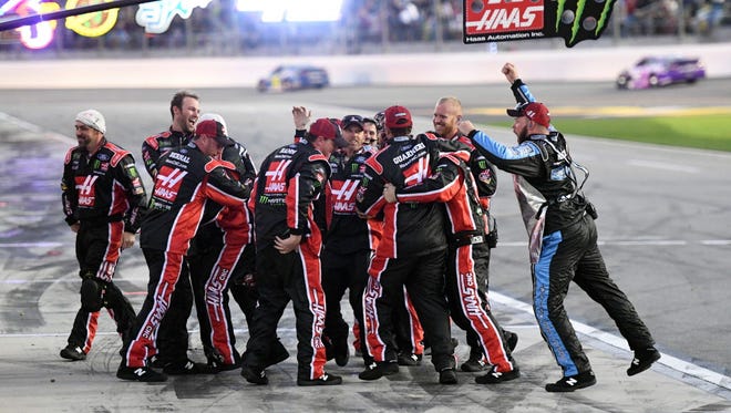 The crew of NASCAR Cup Series driver Kurt Busch (41) celebrates winning the 2017 Daytona 500.